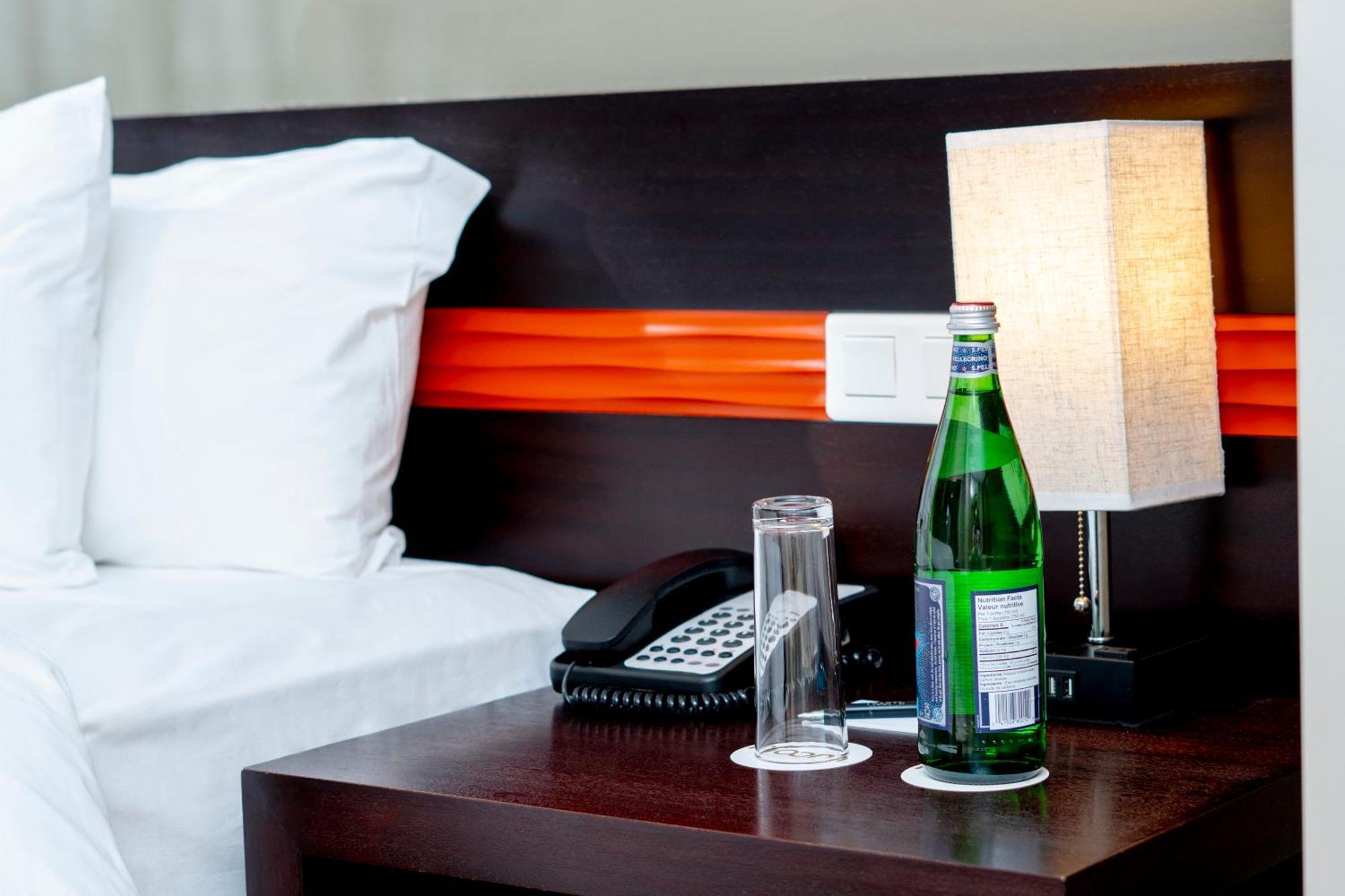 Noom Hotel Dakar Sea Plaza, A Member Of Radisson Individuals Exterior photo A bottle of mineral water in a hotel room
